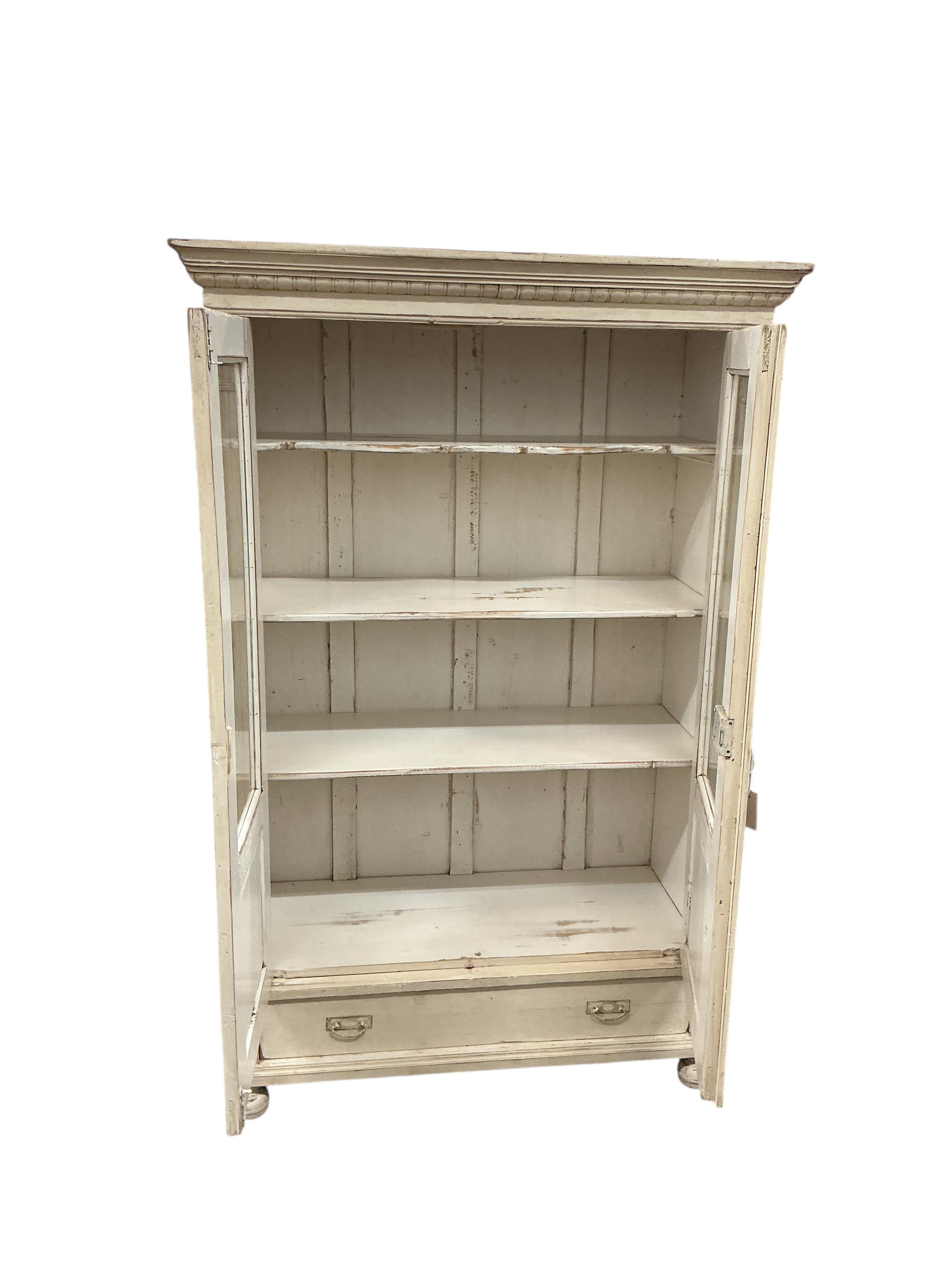A 19th century East European painted glazed pine cabinet, width 114cm, depth 52cm, height 177cm